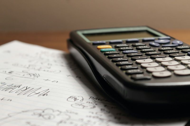 A calculator on handwritten notes