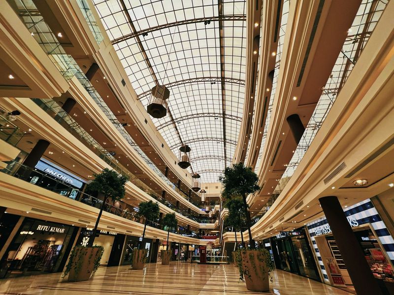 A shopping mall under a glass roof